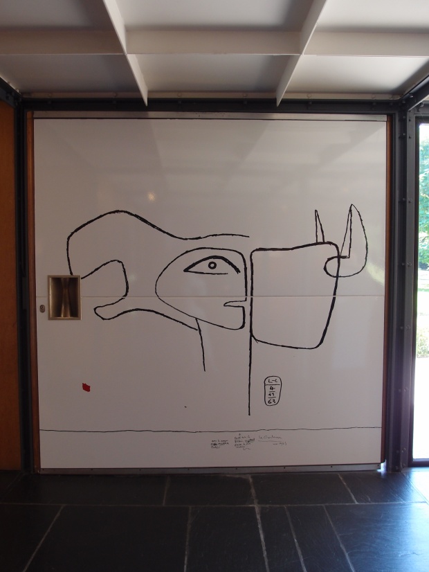 360 degree rotating wooden door with a Corbusier drawing. 